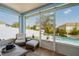 Cozy sunroom with screened windows providing serene views of the pool and backyard at 3215 Park Branch Ave, Clermont, FL 34711
