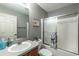 Bathroom featuring a vanity, toilet, and shower with glass doors in a neutrally decorated home at 3218 Woodridge Dr, The Villages, FL 32162