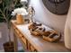 Stylish entryway featuring wooden console table with decorative objects, enhancing the welcoming atmosphere at 3218 Woodridge Dr, The Villages, FL 32162