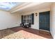 Inviting front porch with seating area, featuring a well-manicured landscape and charming curb appeal at 3218 Woodridge Dr, The Villages, FL 32162
