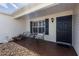 Inviting covered front porch with chairs, perfect for enjoying the outdoors and neighborhood views at 3218 Woodridge Dr, The Villages, FL 32162