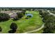 Expansive golf course with mature trees, manicured fairways, a water feature, and various sand traps at 3218 Woodridge Dr, The Villages, FL 32162