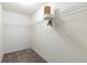 Spacious walk-in closet with ample shelving for optimal storage and organization at 3218 Woodridge Dr, The Villages, FL 32162