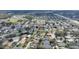 Expansive aerial view of a residential neighborhood with mature trees and well-maintained homes at 3310 Osprey Hill St, Clermont, FL 34714