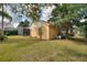 Spacious backyard showing an enclosed pool and lush greenery, enhancing the outdoor living experience at 3310 Osprey Hill St, Clermont, FL 34714