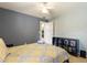Cozy bedroom with plush carpet, neutral paint, ceiling fan, and storage shelves is ready to enjoy at 3310 Osprey Hill St, Clermont, FL 34714