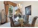 Dining room featuring a decorative light fixture and large windows at 3310 Osprey Hill St, Clermont, FL 34714