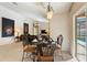 Dining room featuring a modern chandelier, art, and views of the pool at 3310 Osprey Hill St, Clermont, FL 34714