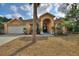 Charming home with arched entry, two car garage, and well-maintained landscaping at 3310 Osprey Hill St, Clermont, FL 34714