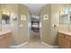 Hallway with neutral paint and tile flooring connects the main bathroom to the main bedroom at 3310 Osprey Hill St, Clermont, FL 34714