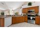 Kitchen with ample counter space, stainless appliances, and breakfast bar at 3310 Osprey Hill St, Clermont, FL 34714