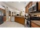 Eat-in kitchen featuring stainless steel appliances and open layout to living areas at 3310 Osprey Hill St, Clermont, FL 34714