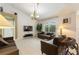 Cozy living room with comfortable seating, tile floors, and a view of the pool at 3310 Osprey Hill St, Clermont, FL 34714