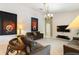 Spacious living room showcasing neutral tones, tile flooring, and elegant decor at 3310 Osprey Hill St, Clermont, FL 34714