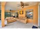 Well furnished patio with a ceiling fan and a beautiful Buddha picture on the wall at 3310 Osprey Hill St, Clermont, FL 34714