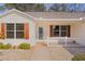 Inviting front porch with decorative stone, offering a warm welcome to this lovely home at 3546 Auburndale Ave, The Villages, FL 32162