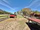 Several animal pens with fencing under blue skies at 37807 Felkins Rd, Leesburg, FL 34788