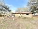 Home backyard featuring a patio with outdoor furniture and yard decor at 37807 Felkins Rd, Leesburg, FL 34788