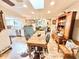 Bright dining room with a wooden table, and an open view of the living room and kitchen at 37807 Felkins Rd, Leesburg, FL 34788