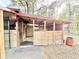 A horse stall made from light-colored wood with a partial covering for weather protection at 37807 Felkins Rd, Leesburg, FL 34788