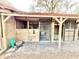 A horse stall row with metal doors and wood dividers, well maintained and practical at 37807 Felkins Rd, Leesburg, FL 34788