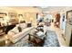Cozy living room with stylish furnishings, ample seating, and a seamless flow into the dining area at 37807 Felkins Rd, Leesburg, FL 34788