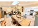 Open-concept living space with a dining area and kitchen, perfect for entertaining guests at 37807 Felkins Rd, Leesburg, FL 34788