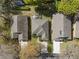 Aerial view of houses with backyard pools, landscaping, and neutral roofs in a residential neighborhood at 3812 Westerham Dr, Clermont, FL 34711