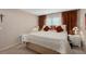 Comfortable bedroom with ceiling fan, window and curtains, and a decorative dresser at 3812 Westerham Dr, Clermont, FL 34711