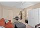 Cozy bedroom featuring a sofa, ottoman, and ample closet space at 3812 Westerham Dr, Clermont, FL 34711