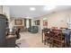 Living area featuring neutral tones, casual furnishings, and an adjacent dining space at 3812 Westerham Dr, Clermont, FL 34711