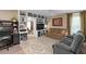 Open living area with built-in shelving, a comfortable sofa, and soft natural light at 3812 Westerham Dr, Clermont, FL 34711