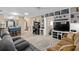 Inviting living room with built-in shelving, comfortable sofas, and plenty of space at 3812 Westerham Dr, Clermont, FL 34711