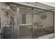 Enclosed patio space with screened-in porch, comfortable seating and lots of privacy at 3812 Westerham Dr, Clermont, FL 34711