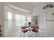 Bright breakfast nook with a glass top table and a large window for natural light at 4034 River Crest Cir, Leesburg, FL 34748