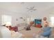 Comfortable living room with a ceiling fan, TV, and plenty of seating at 4034 River Crest Cir, Leesburg, FL 34748