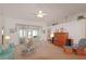 Spacious living room with ceiling fan, offering ample seating and natural light at 4034 River Crest Cir, Leesburg, FL 34748