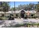 Exterior view of a bar and grill with a golf cart parked nearby at 4034 River Crest Cir, Leesburg, FL 34748
