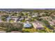 Single-story home nestled within a scenic community, boasting lush landscaping and serene streetscapes under the sun at 5095 China Sea Dr, Tavares, FL 32778