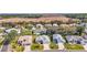 An aerial view of a residential neighborhood featuring well-maintained homes and landscaping at 5095 China Sea Dr, Tavares, FL 32778