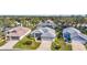 Nice neighborhood with single-story homes, well-maintained lawns, and mature trees on a sunny day at 5095 China Sea Dr, Tavares, FL 32778