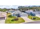 Charming single-story home with attached garage, screened porch, and well-manicured lawn in a friendly neighborhood at 5095 China Sea Dr, Tavares, FL 32778