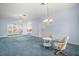 Spacious living room featuring a ceiling fan and arched doorway, perfect for entertaining at 5095 China Sea Dr, Tavares, FL 32778
