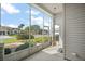 Relax on the screened porch with views of the well-maintained landscaping and neighborhood at 5095 China Sea Dr, Tavares, FL 32778