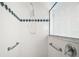 Tiled shower with grab bars and shower head at 5095 China Sea Dr, Tavares, FL 32778