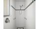 Tiled shower with grab bars and decorative tile border at 5095 China Sea Dr, Tavares, FL 32778