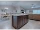 Open concept kitchen with island flows into dining and living area, great for entertaining at 51 Almond Rd, Ocala, FL 34472