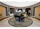 Elegant lobby showcasing a grand piano, comfortable seating, and refined architectural details at 525 Narrow View Ln, Groveland, FL 34736