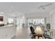 Open-concept living area offers comfortable seating, natural light, and seamless integration of indoor-outdoor living at 5819 White Ibis, The Villages, FL 32163