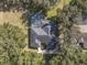 Bird's eye view of home with pool and landscaping at 5910 Lake Emma Ct, Groveland, FL 34736